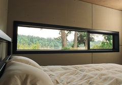 WDMA long narrow horizontal window above bed